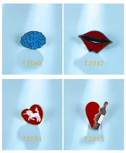 Set of four creative cartoon enamel brooch pins with brain, lip and heart motifs.