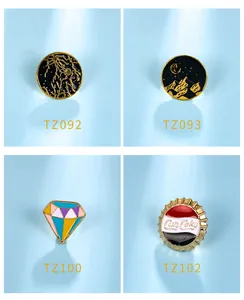Detailed view of four assorted cartoon enamel lapel pins with unique graphic designs