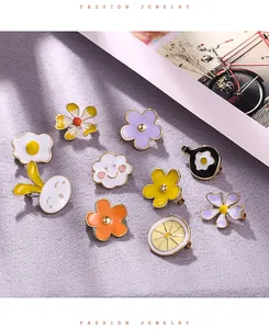 Detailed view of various cute colorful enamel alloy pins and brooches for accessories