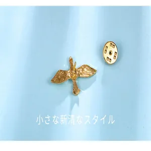 Detailed back view of a golden bird shaped anti-exposure lapel pin for summer shirts