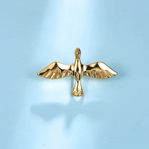Minimalist gold bird-shaped brooch pin for stylish summer shirts and t-shirts