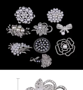 Detailed view of elegant pearl and rhinestone brooches in various floral and bow designs