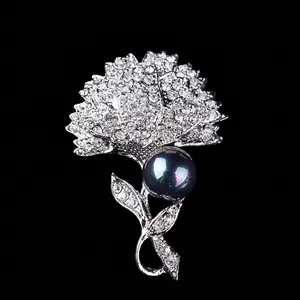 Elegant vintage flower brooch pin with sparkling rhinestones and a large dark pearl