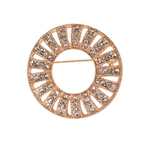 Elegant vintage round sunburst brooch set with sparkling crystals in a rose gold finish