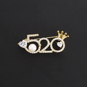 Elegant gold-tone 520 heart brooch with pearl and crown accessory for suits and shirts