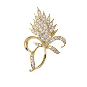 Elegant gold plant leaf brooch with sparkling cubic zirconia crystals for women