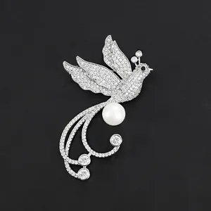 Elegant silver-colored phoenix bird brooch with pearl and sparkling crystal accents