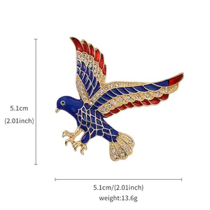 Detailed view of an eagle brooch featuring blue and red enamel and crystals, 5.1cm size
