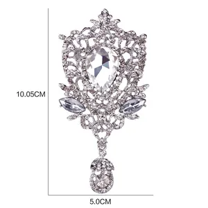 Detailed view of a large silver crystal brooch with 10.05cm by 5.0cm dimensions.