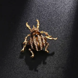 Elegant gold beetle insect brooch pin with sparkling crystals and brown enamel