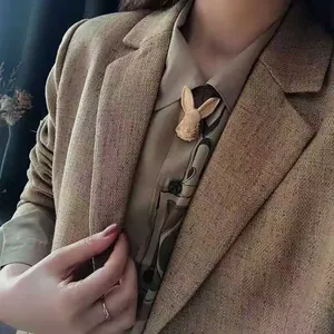 Antique style gold rabbit head brooch pin accessory for elegant women's blazer styling