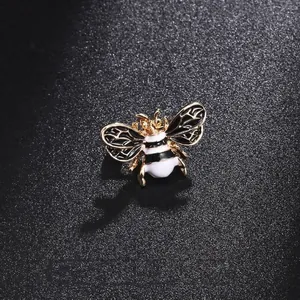 Cute insect honeybee brooch pin with gold-toned metal and black white enamel details