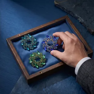 Elegant colorful crystal flower wreath brooches set in wooden display tray