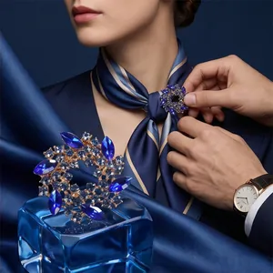 Elegant blue crystal wreath brooch accessory for women's scarves and fashion clothing.