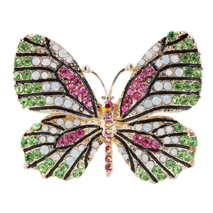 Elegante spilla a farfalla con strass colorati in lega tonalità oro per decorazione.