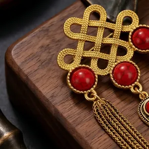 Elegant ethnic style brooch with gold Chinese knot and red turquoise beads tassels