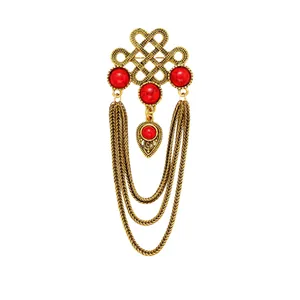 Vintage ethnic style red stone brooch with dangling gold-tone chains for suits