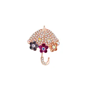 Elegante spilla a ombrello in oro rosa con fiori di cristallo e strass colorati