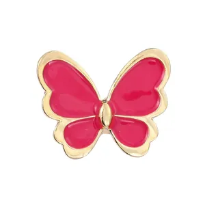 Elegante spilla a farfalla rosa con bordo dorato e finitura in smalto a goccia