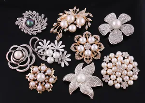 Variety of elegant pearl and rhinestone brooches for women's fashion and accessories.