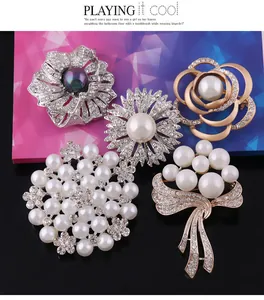 Detail view of various elegant pearl and rhinestone brooches for women's fashion