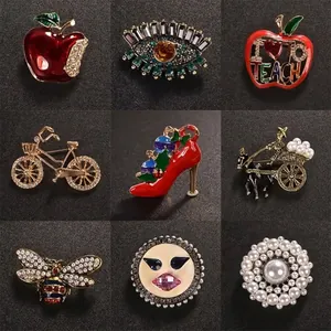 Set of elegant rhinestone brooches with various artistic designs and enamel finish