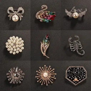 Elegant assortment of crystal and pearl brooches for women on a black background
