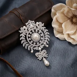 Ornate vintage crystal brooch with teardrop pearls and zircons for elegant suit styling