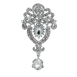 Elegant ornate silver-tone crystal brooch featuring teardrop pendants for formal suits and coats