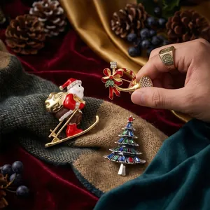 Exquisite close-up of vintage Christmas brooches featuring Santa and a festive tree.