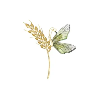Elegant gold-tone wheat ear and butterfly wing brooch pin with yellow crystals
