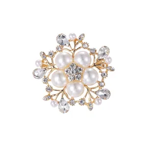 Elegant pearl and crystal flower brooch pin for suits and sweaters on white background.