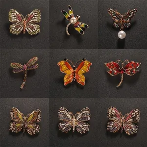 Set of 9 vintage butterfly and dragonfly brooches with colorful rhinestones and enamel
