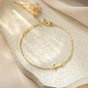 Elegant gold stainless steel jewelry bracelet featuring a delicate letter L initial charm