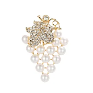 Elegant grape cluster brooch with pearl beads and crystal-encrusted leaf motif