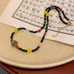 Elegante Halskette im neuen chinesischen Stil mit bunten Kristallperlen und Glückskugel