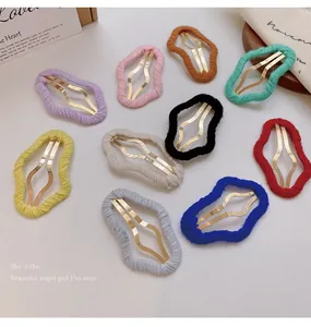 Close-up view of ten assorted colorful yarn-wrapped wavy metal BB clips for women