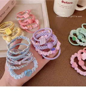 Close-up detail of colorful dopamine-style elastic hair ties in various sweet designs