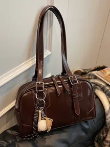 Large capacity dark brown glossy underarm tote bag with stylish baseball charm