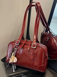 Large capacity burgundy shoulder bag in glossy faux leather with baseball charm