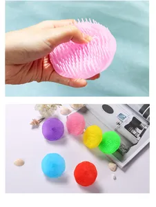 Macro detail of soft silicone bristles on a pink scalp massager and shampoo brush tool