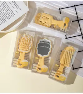 Detailed view of yellow cloud series mirror and hairbrush set in transparent packaging