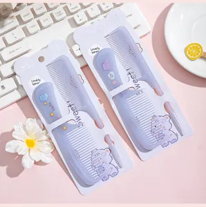 Detailed view of the cute 2-piece cartoon bear hair comb set in its portable white packaging
