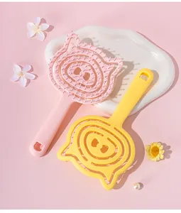 Cute cartoon pig shaped detangling hair brush set in pink and yellow colors.
