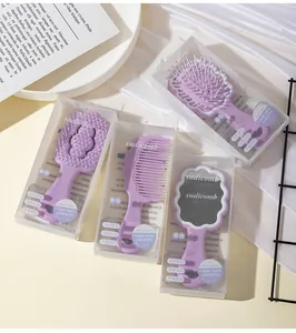 Close-up of Sudi Cloud series purple hairbrush and mirror set for kids in clear boxes
