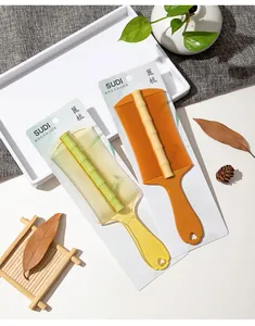 Professional fine-tooth nit combs with bamboo-textured design in retail packaging.