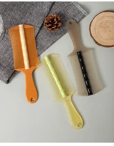 Detail view of bamboo-joint fine-tooth combs in multiple colors for hair cleaning
