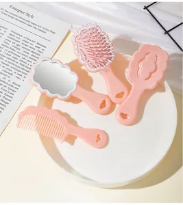 Portable pink cloud-shaped hairbrush and mirror set for kids with unique scalloped edges design