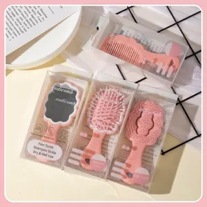 Pink cloud hair brush and mirror set in minimalist packaging, top view