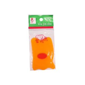Professional orange resin gua sha massage tool for face and body in retail packaging